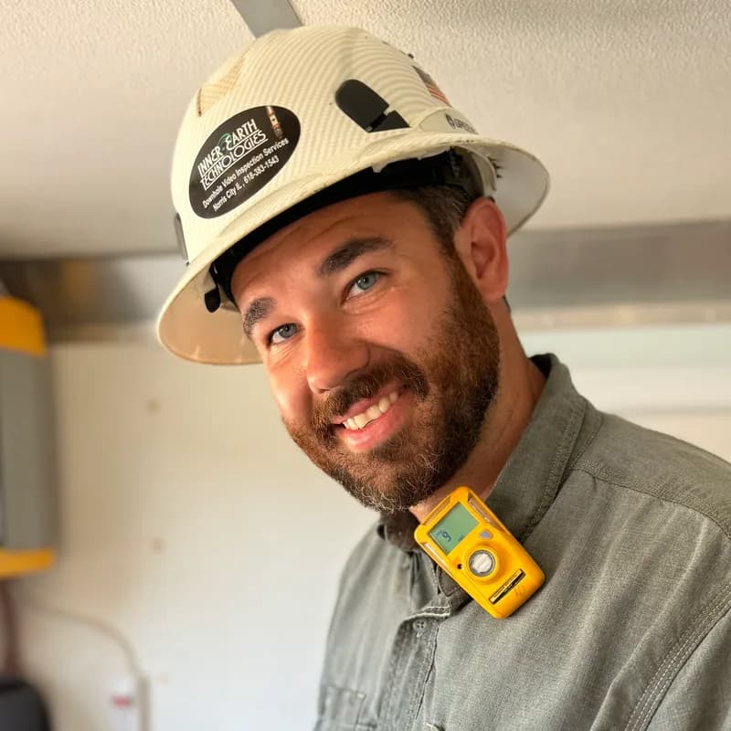 Nevan Leu, LeaseSight founder, in an Inner Earth Technologies hard hat with a field tablet in hand